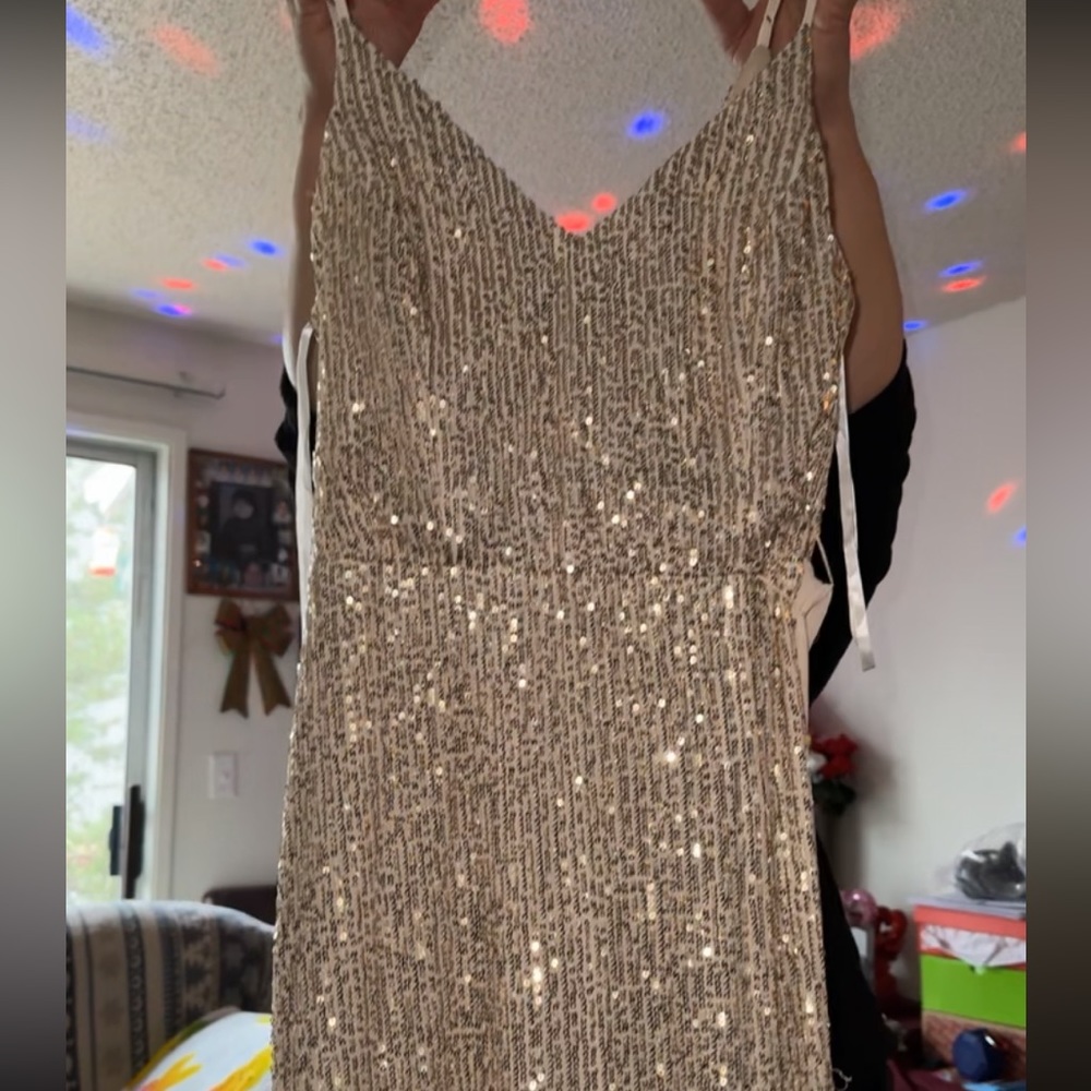 Floor length gold spaghetti strap dress with slit on the side